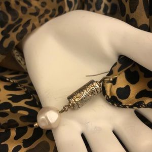 Beautiful dangling pearl earrings with gold tone